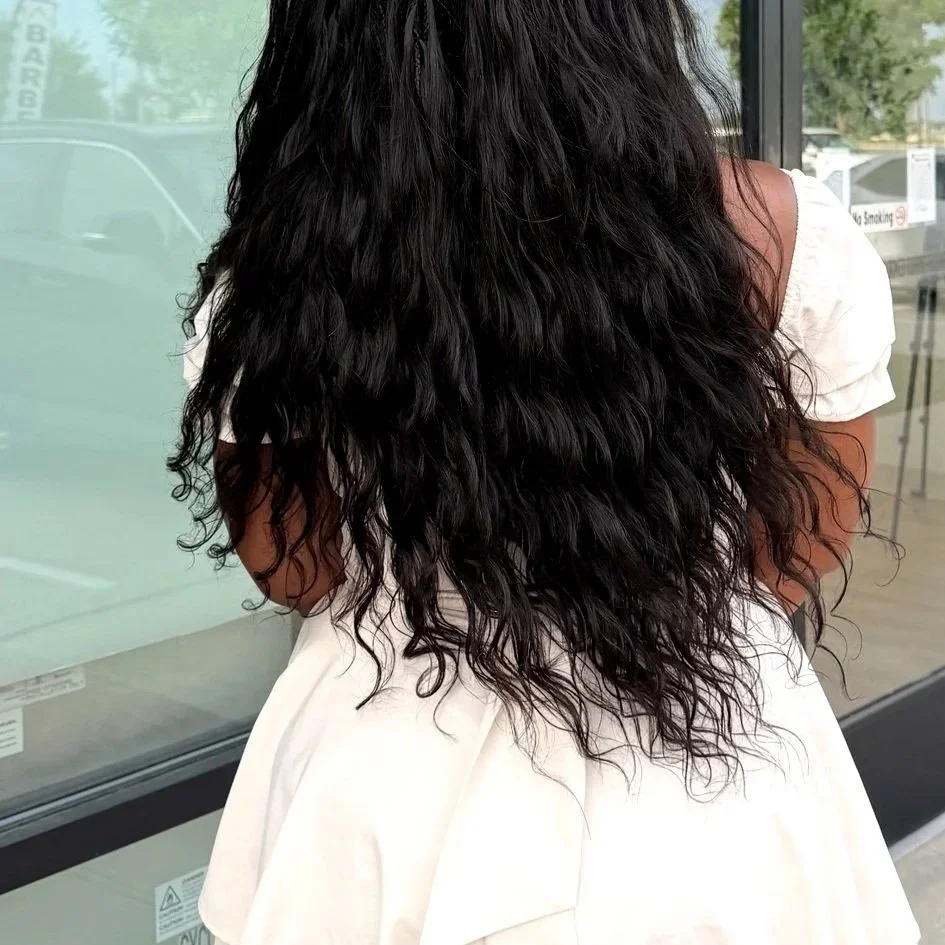 Miracle Knots with loose body wave curls for a soft, low-maintenance finish at Legacy Braids in McKinney, TX