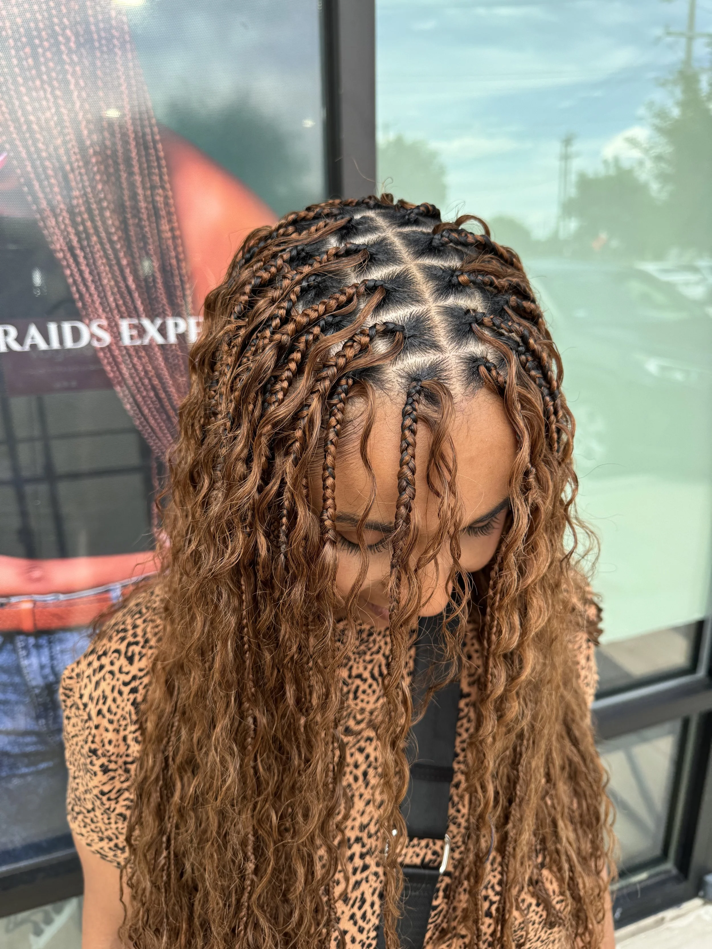 Boho braids with brown curly human hair and detailed parting at Legacy Braids in McKinney, TX