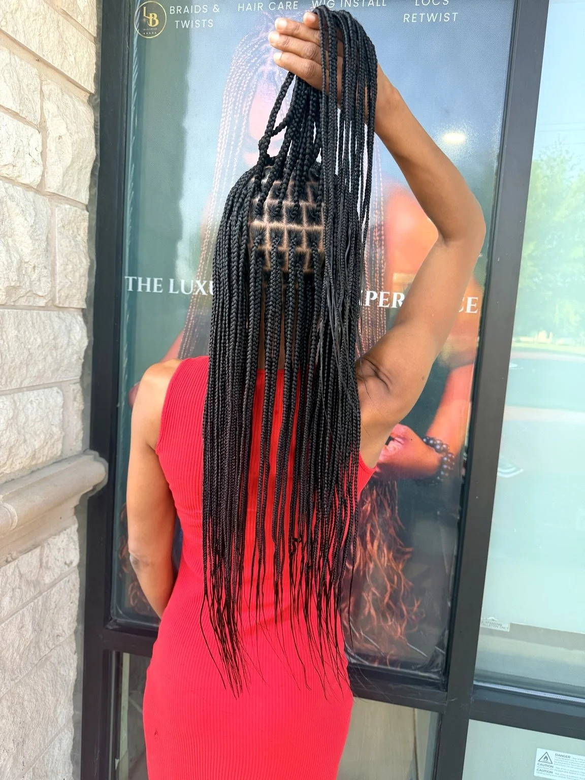 Small knotless braids with clean, precise parting at Legacy Braids in McKinney, TX