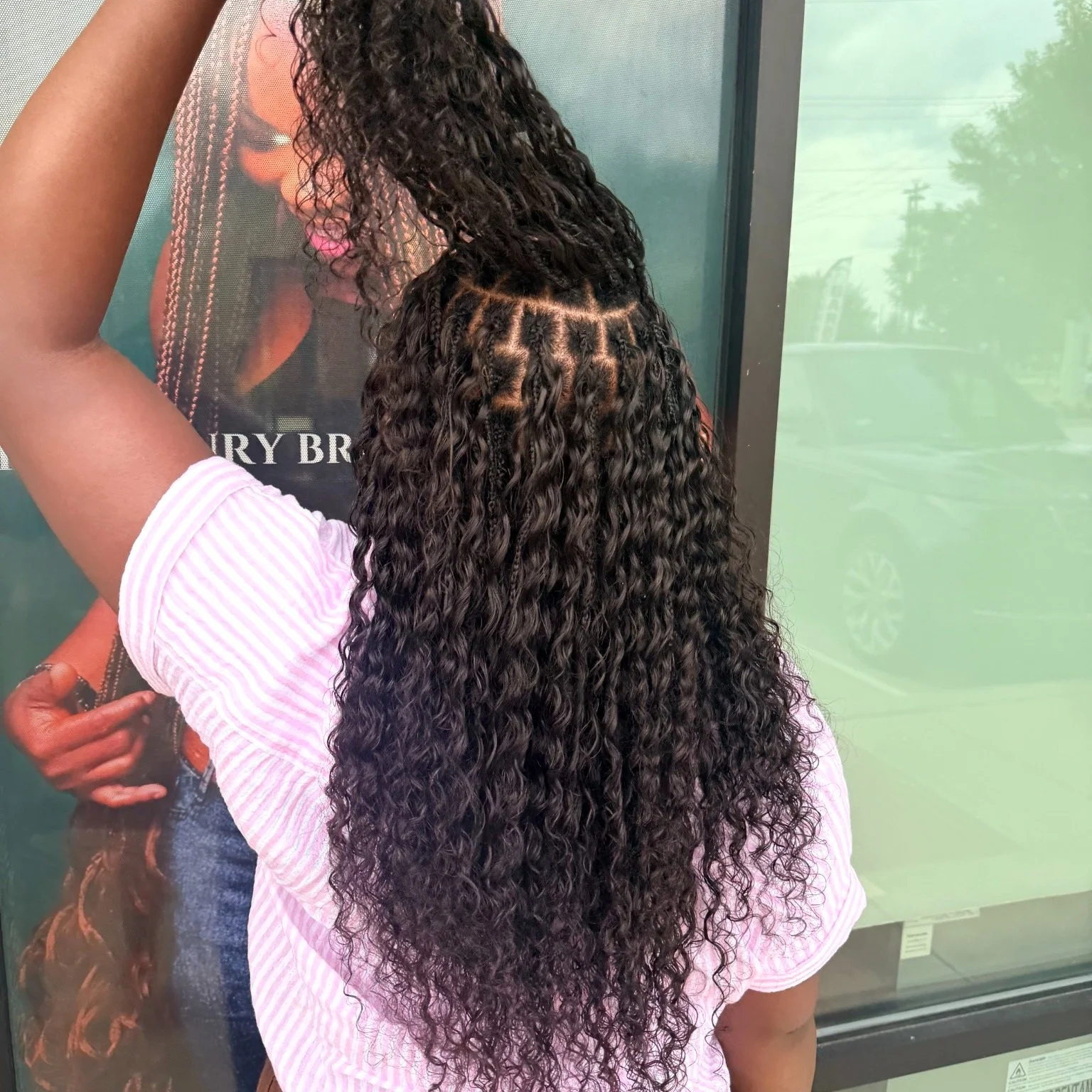 Full-density Miracle Knots with long black curly human hair at Legacy Braids in McKinney, TX