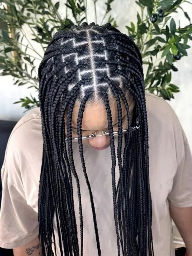 Small-medium knotless braids with neat, consistent parting at Legacy Braids in McKinney, TX