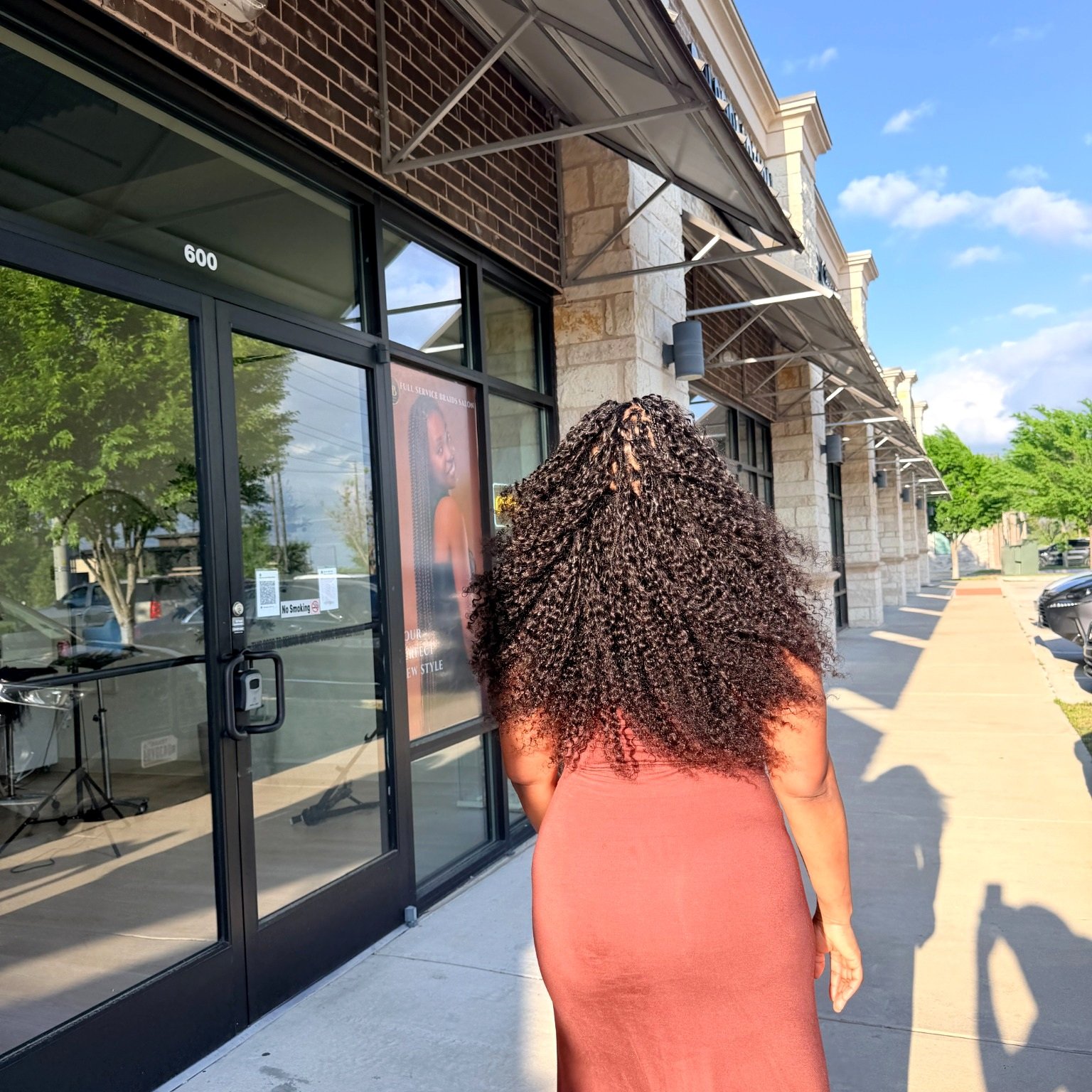 Natural Black Miracle Knots with curly human hair shown outdoors at Legacy Braids in McKinney, TX