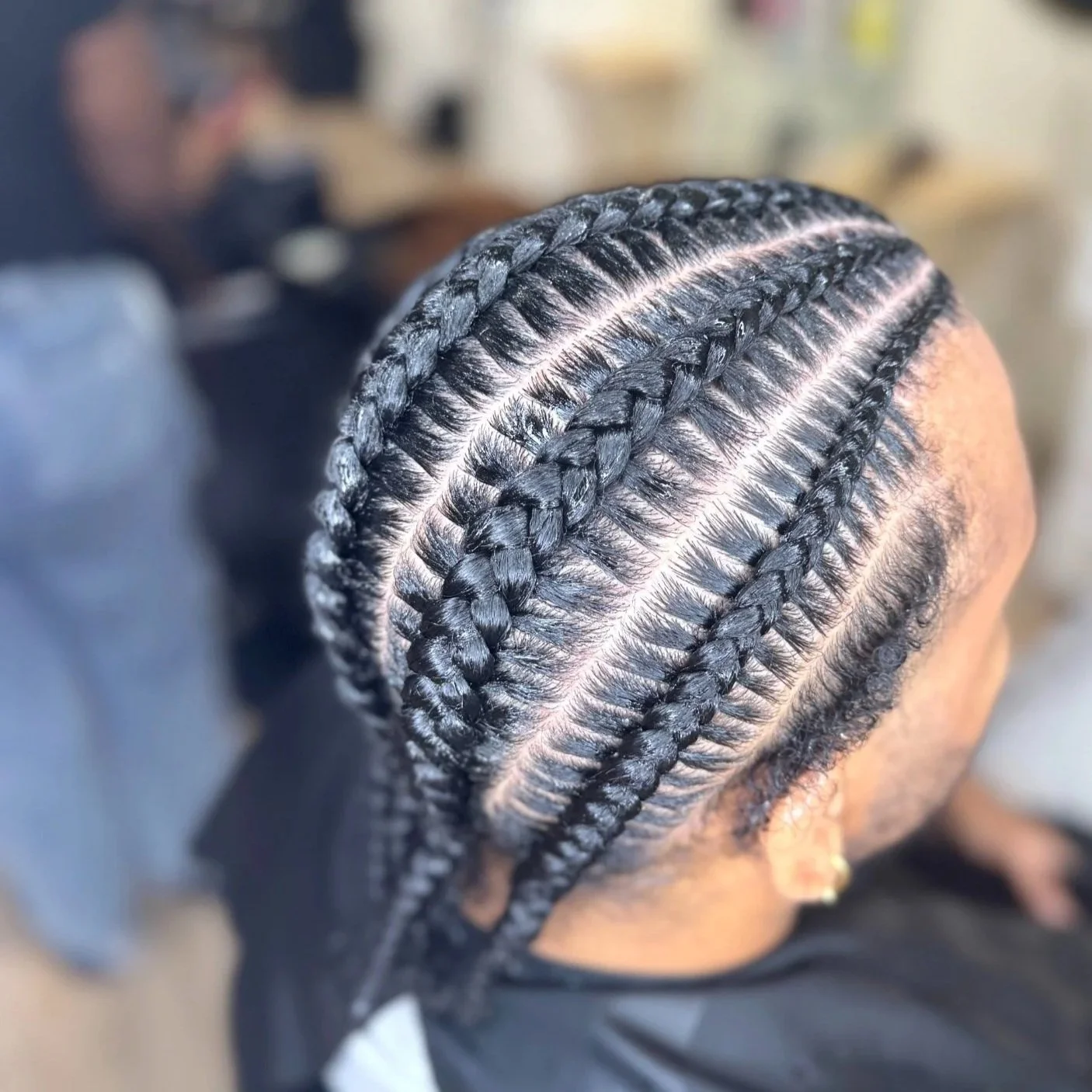 Men’s six stitch braids with evenly spaced sections and clean stitching