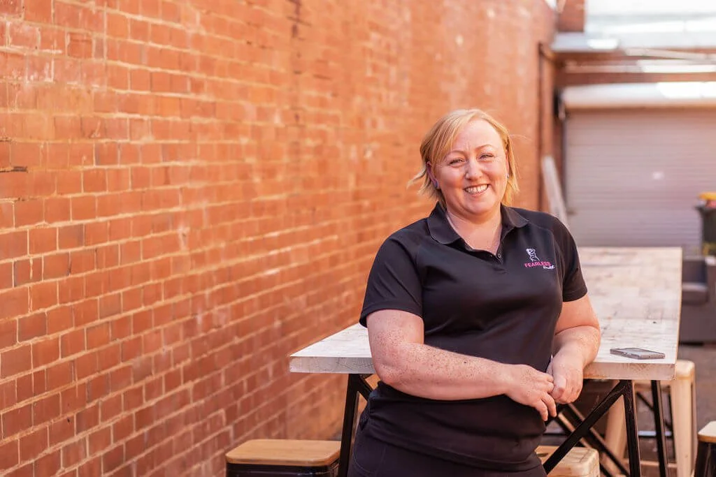 Melissa Woodward from fearless health smiling looking at the camera