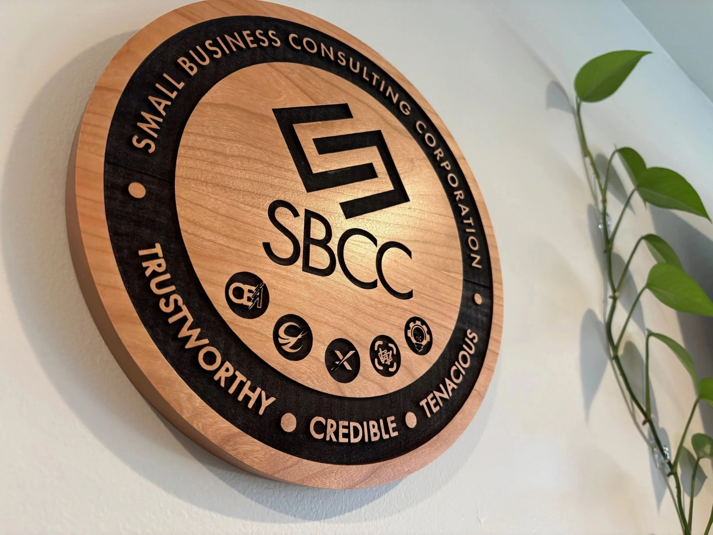 Personalized wooden business sign engraved with custom logo, rustic wood wall decor for small business branding and office spaces