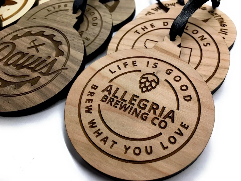 Custom engraved wooden Christmas ornaments personalized with business logo