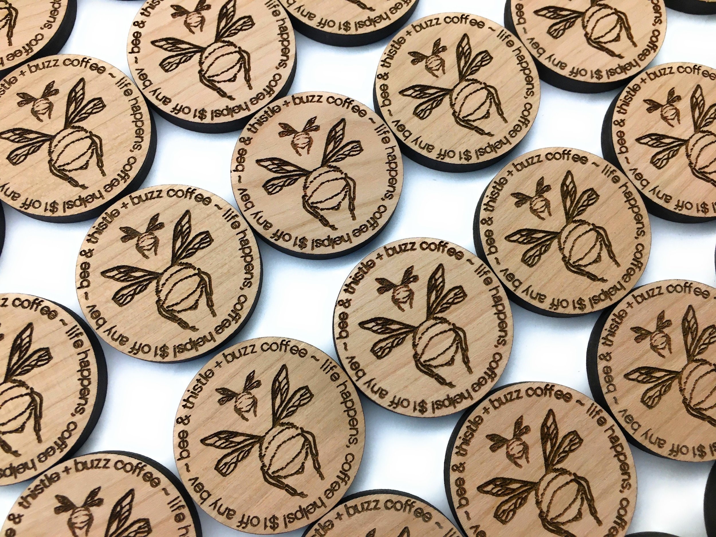 Custom wood coins with your logo engraved. These wood tokens are great for drink tokens or business cards.