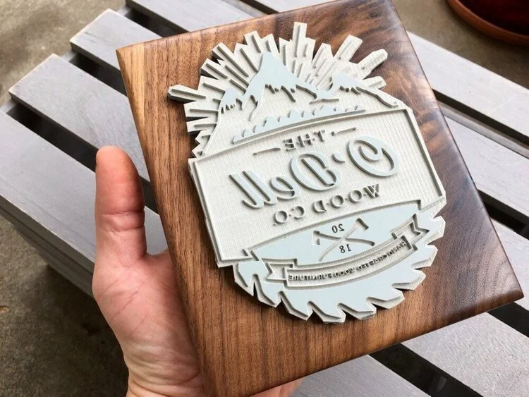Custom rubber stamp engraved with business logo for packaging and branding