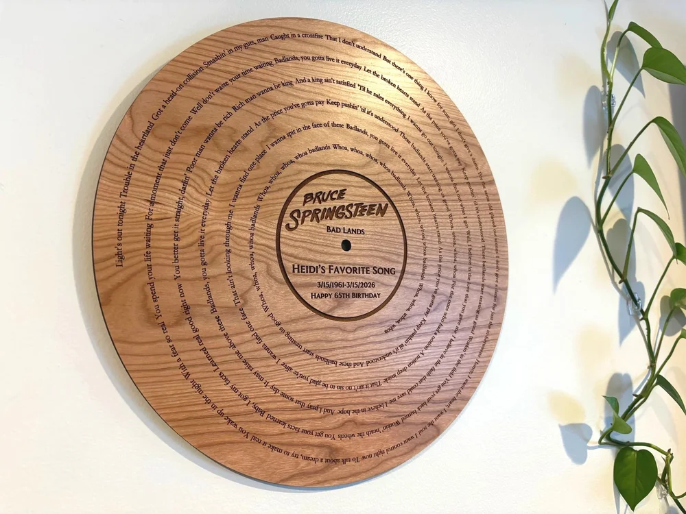 Personalized wooden song lyrics plaque with record inspired spiral design