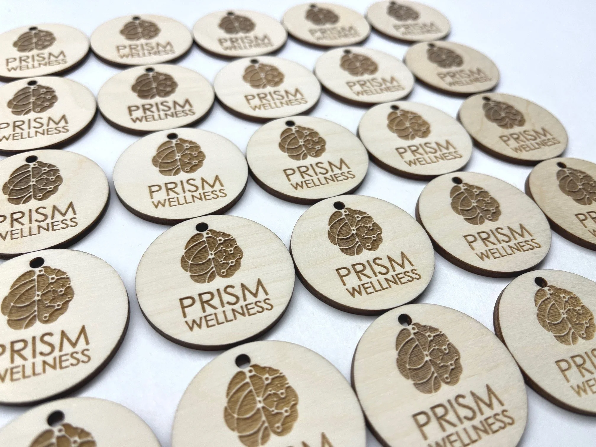 Custom engraved wood tags made from birch – personalized with logos, names, or text for small business branding, gift wrapping, product packaging, or event favors.