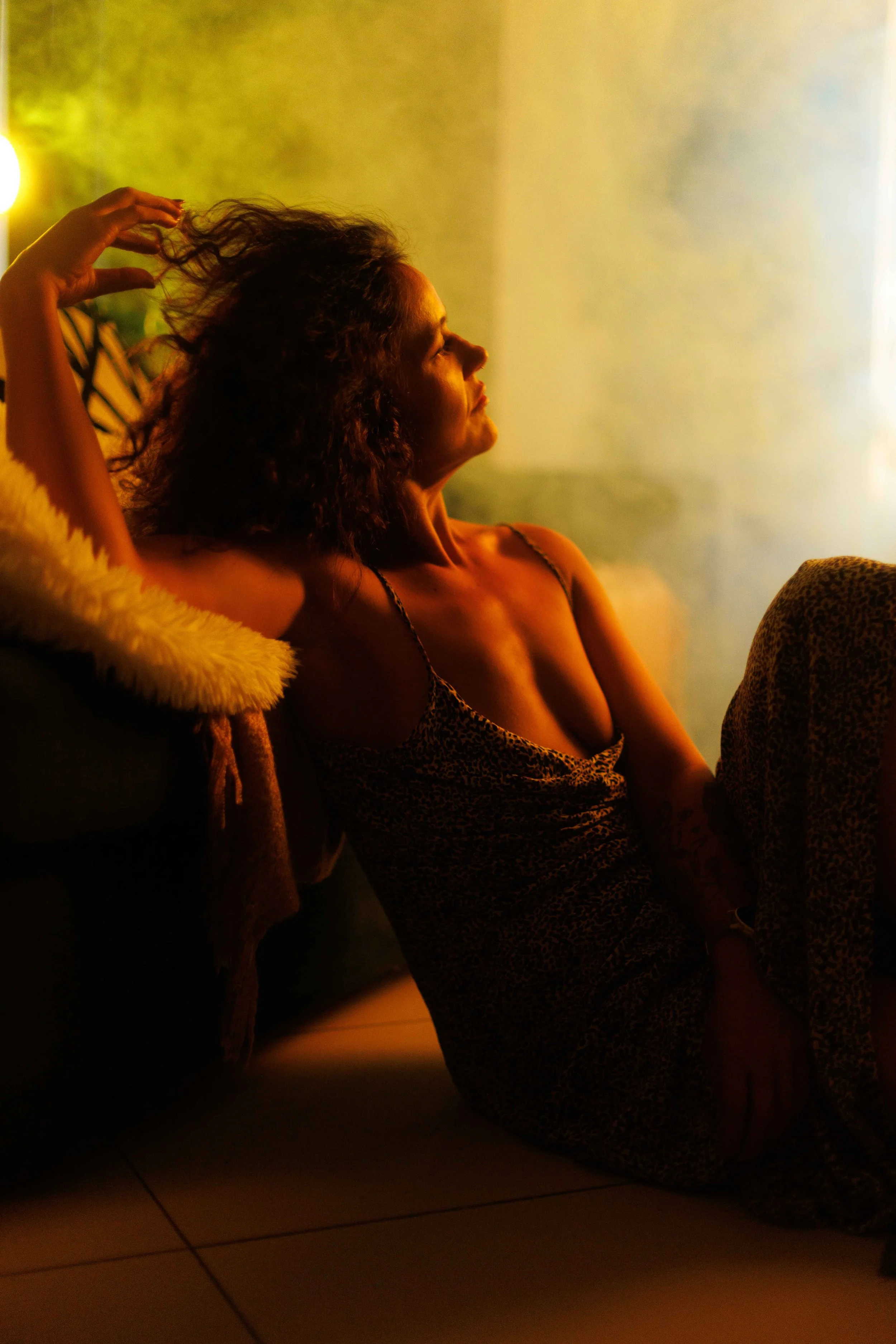 Confident woman over 40 enjoying a luxury boudoir photoshoot