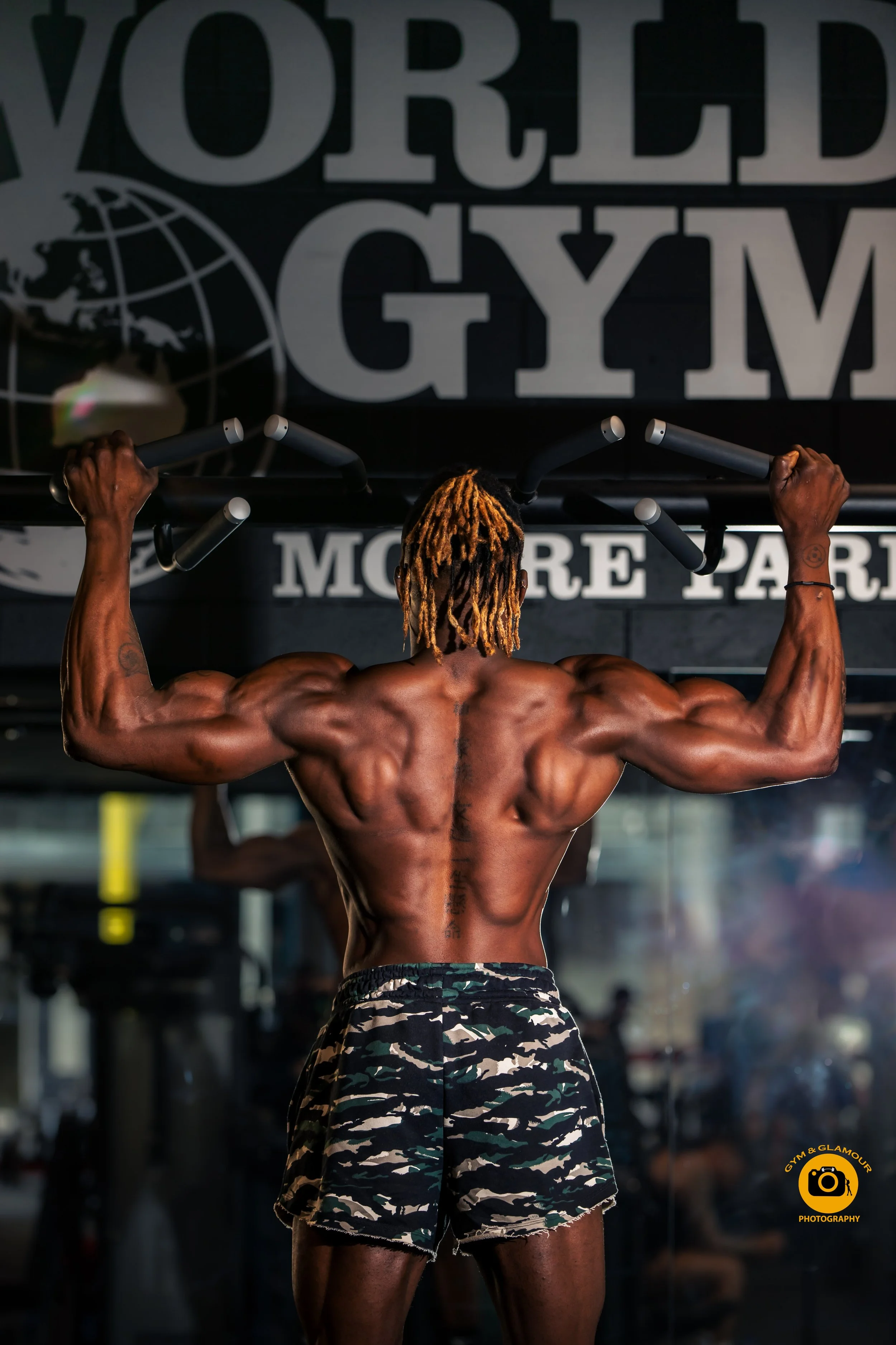 Bodybuilder posing during a peak-week photoshoot in Sydney