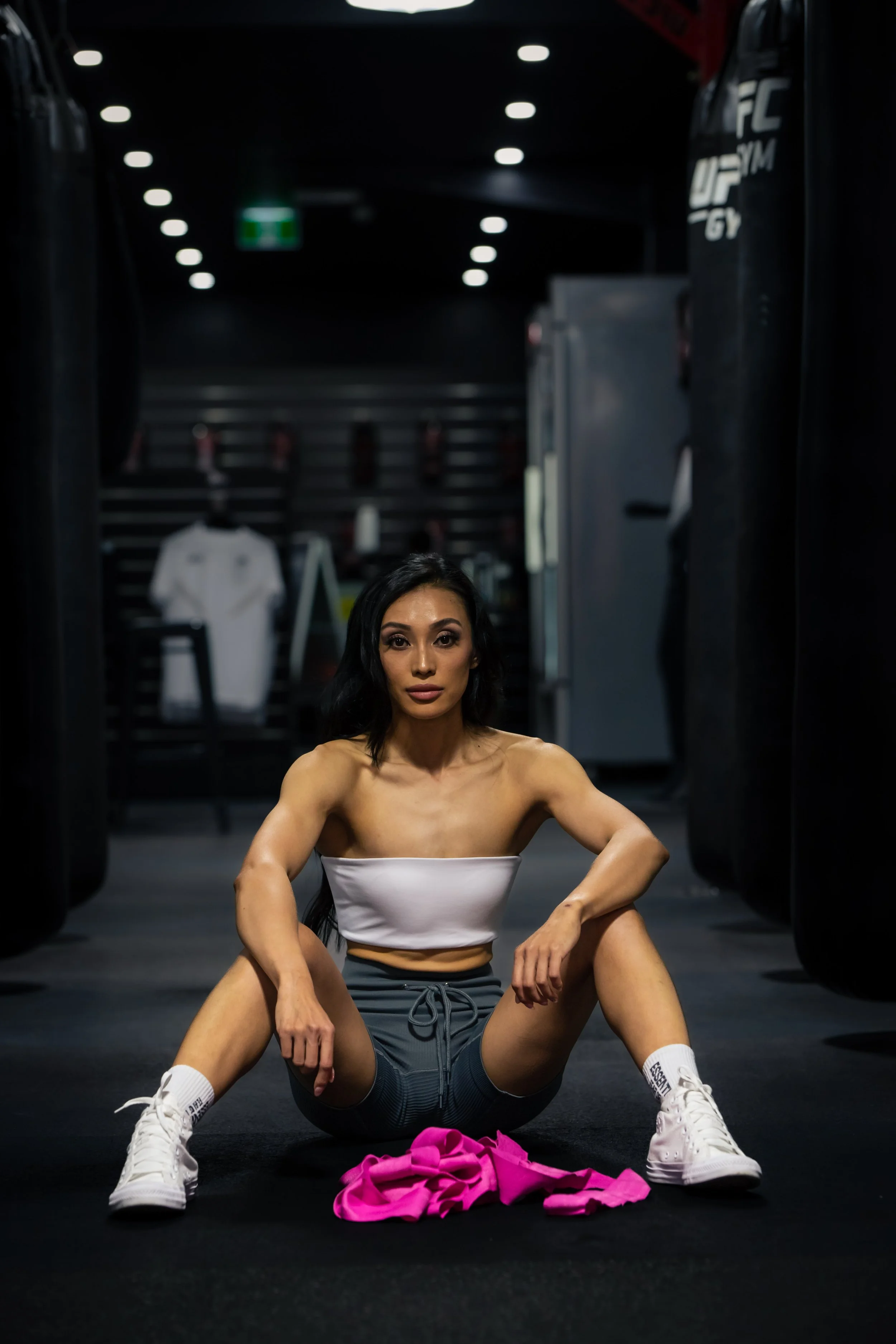 Woman posing confidently during fitness photoshoot in Sydney gym.