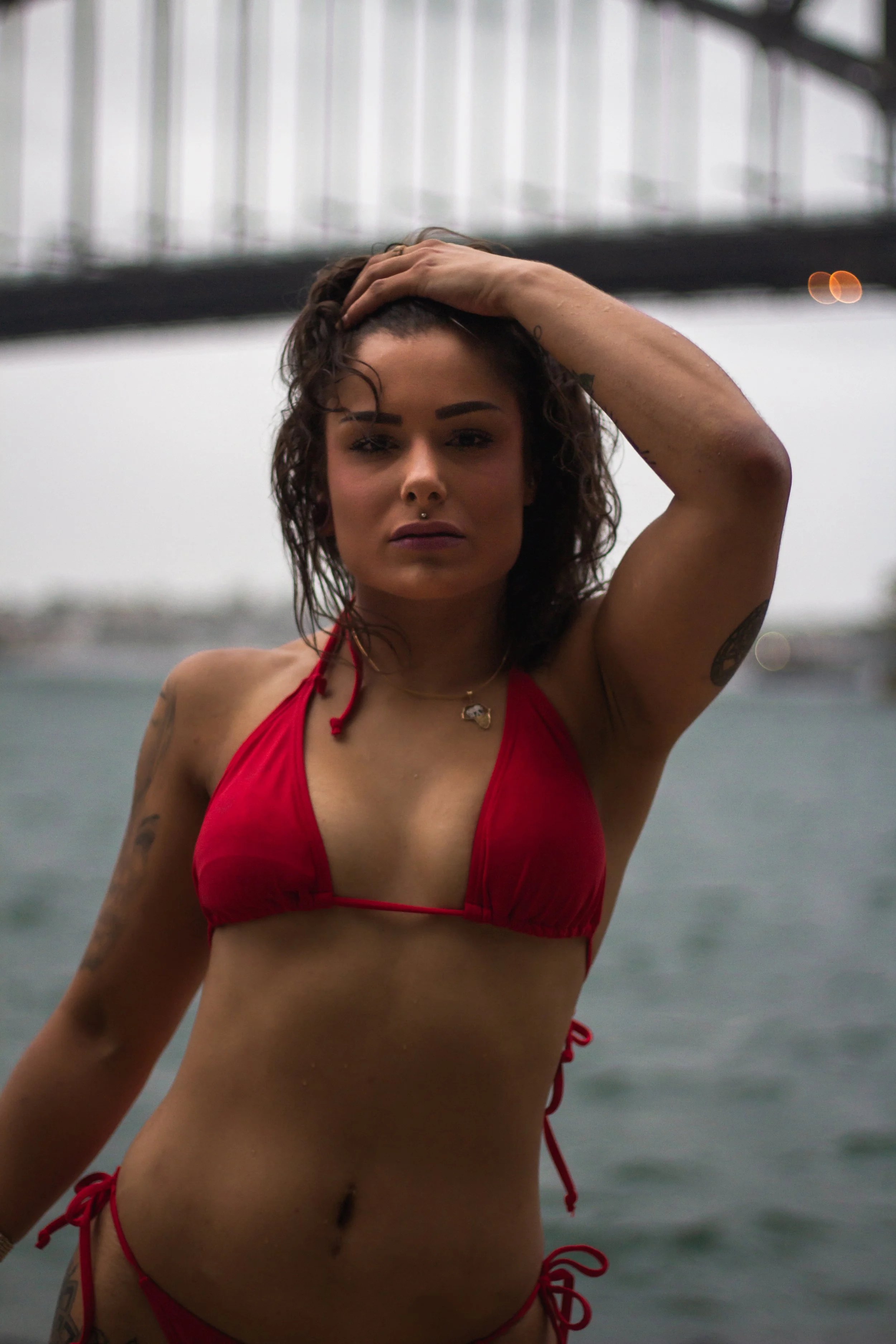 fitness photoshoot of women posing under sydney harbour bridge