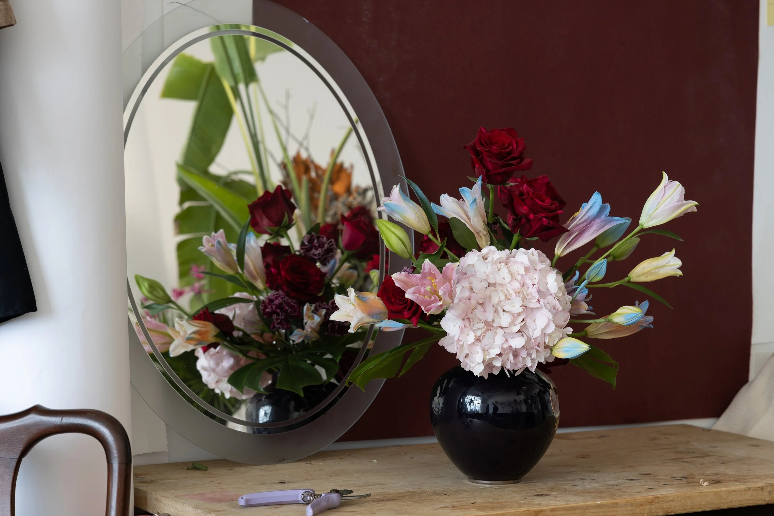 Floral arrangement inspired by the movie, “Georgia & Georgia.” Photo credit: Tobi Abawonse Photography.