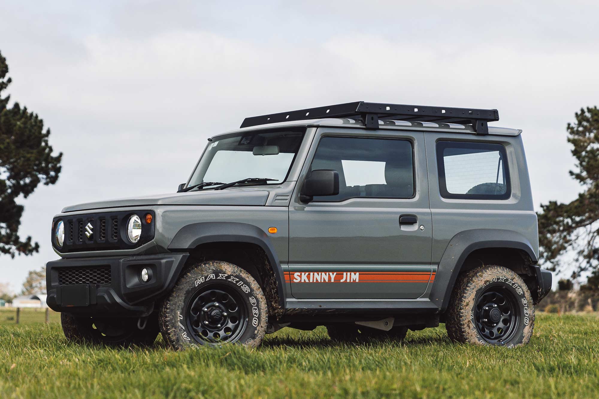Jimny with roof platform in muddy paddock