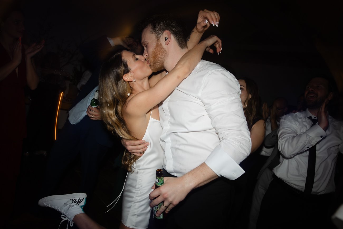 Bride and Groom kiss on the dance floor at their Wallkill NY wedding.