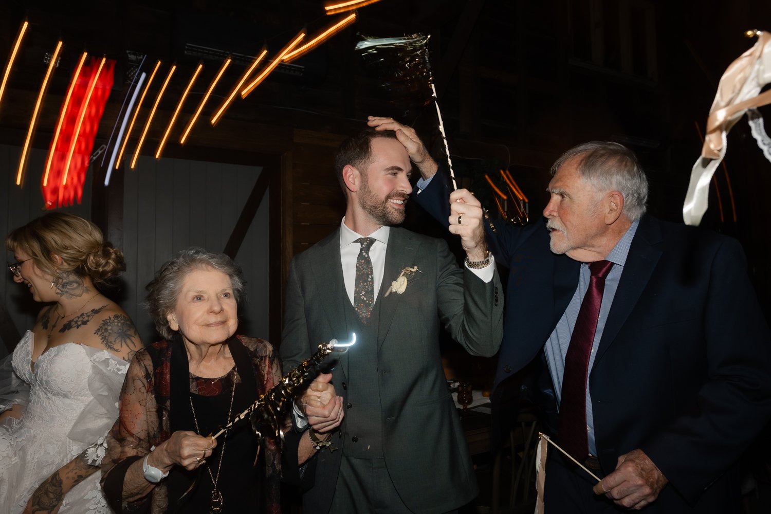 Groom dances with his grandparents at his wedding reception in the Catskills.