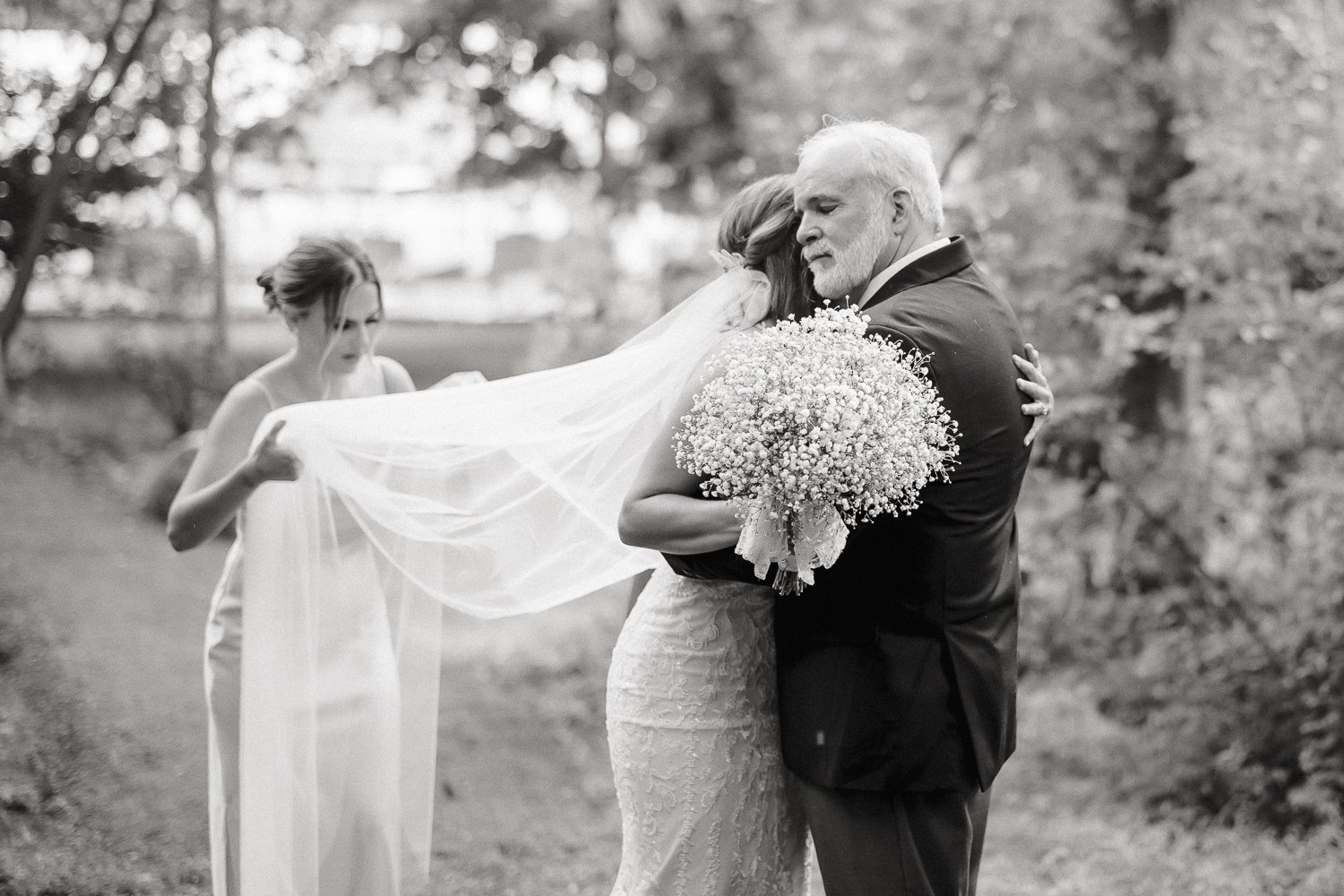 Father hugs his daughter right before she walks down the aisle to her wedding in New paltz.