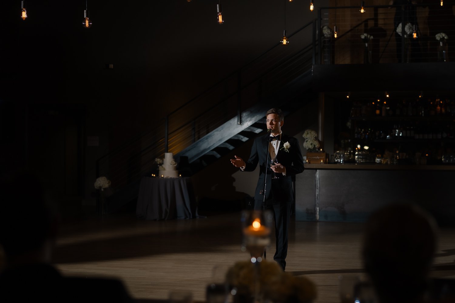 Best man give a toast bathed in perfect light.