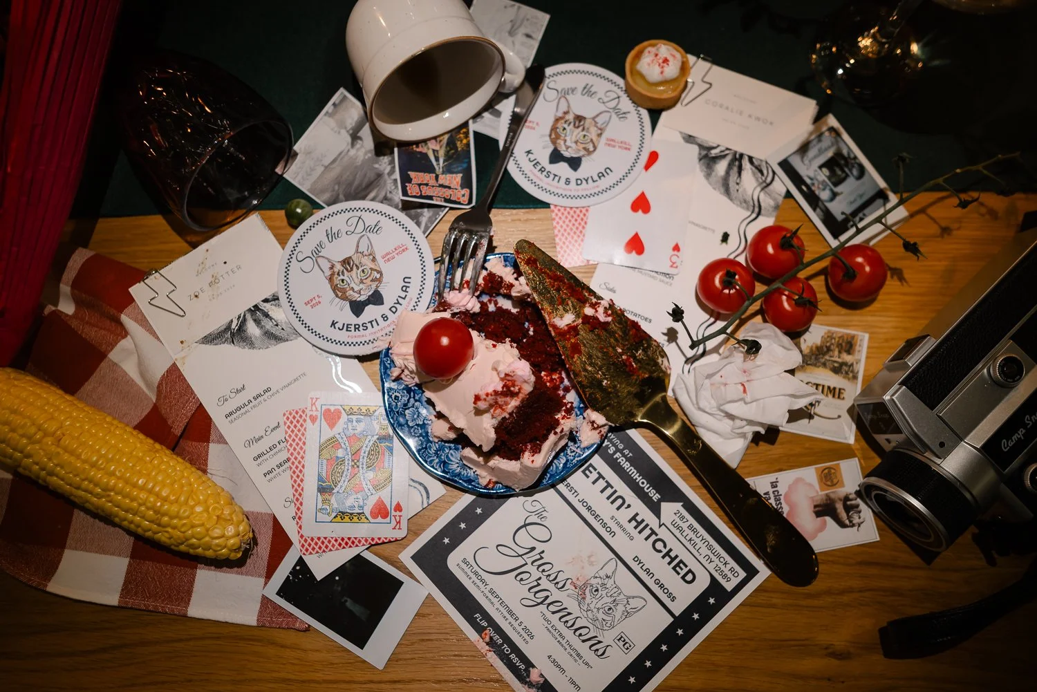 Half eaten cake, party favors, bowties and coasters jumbled together to show the remainder of the wedding night.