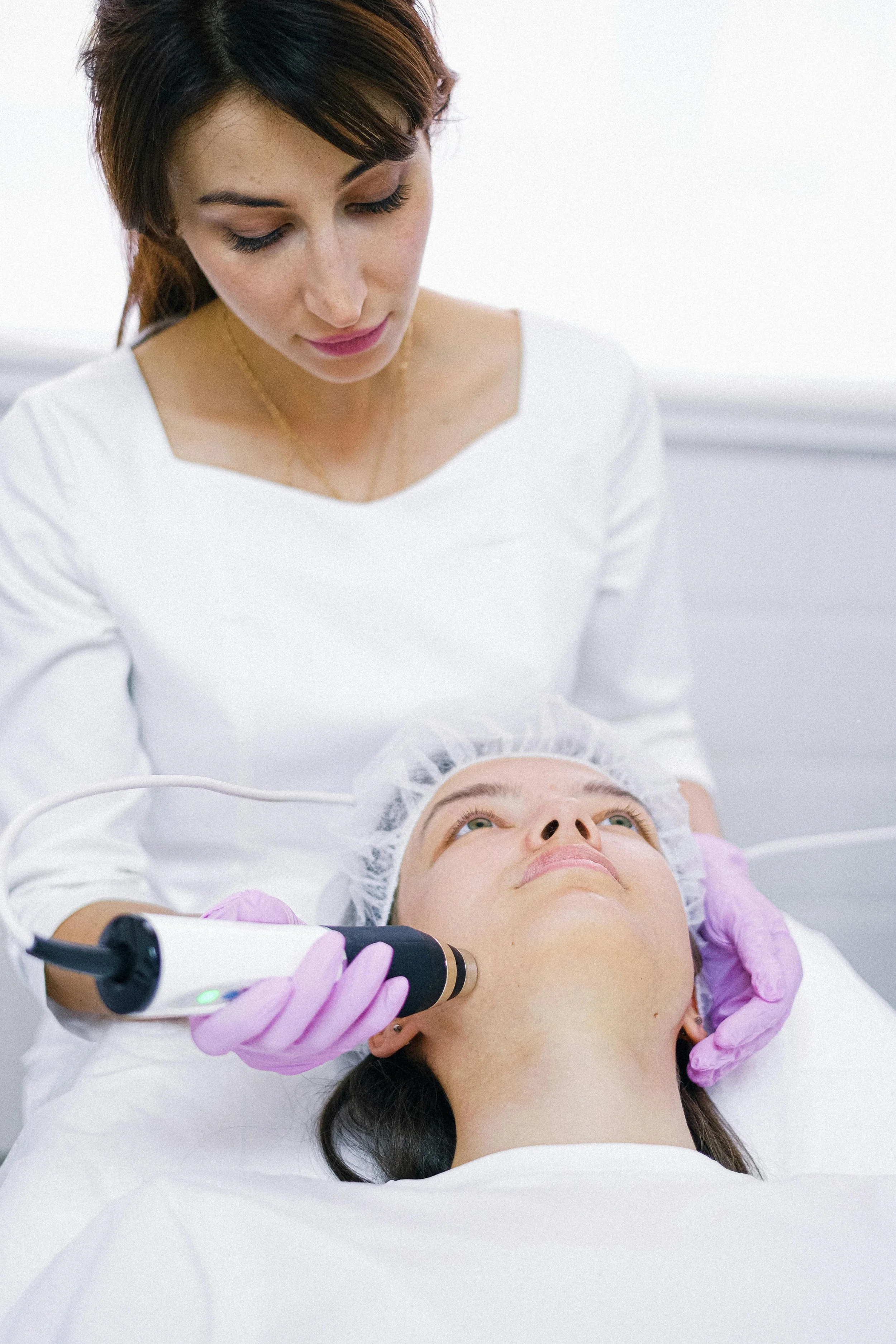Esthetician giving a hydrofacial