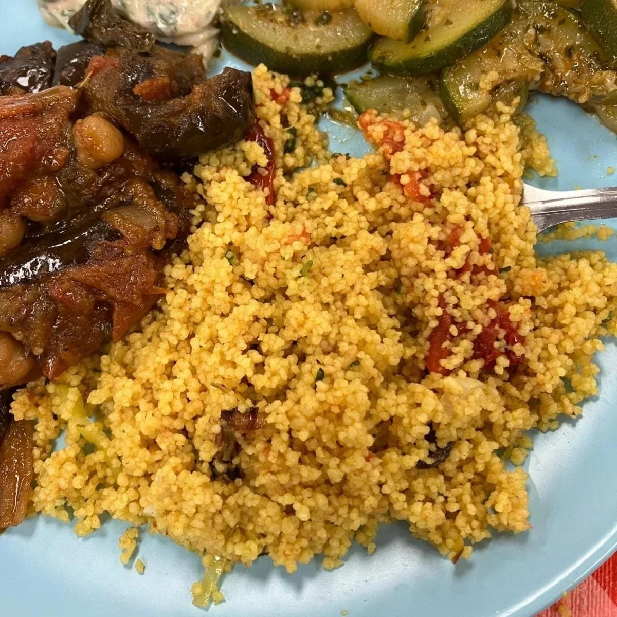 Close up photo of plate with couscous and vegetables