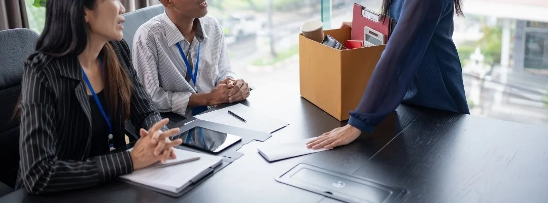 Business professionals collaborating to reduce employee turnover