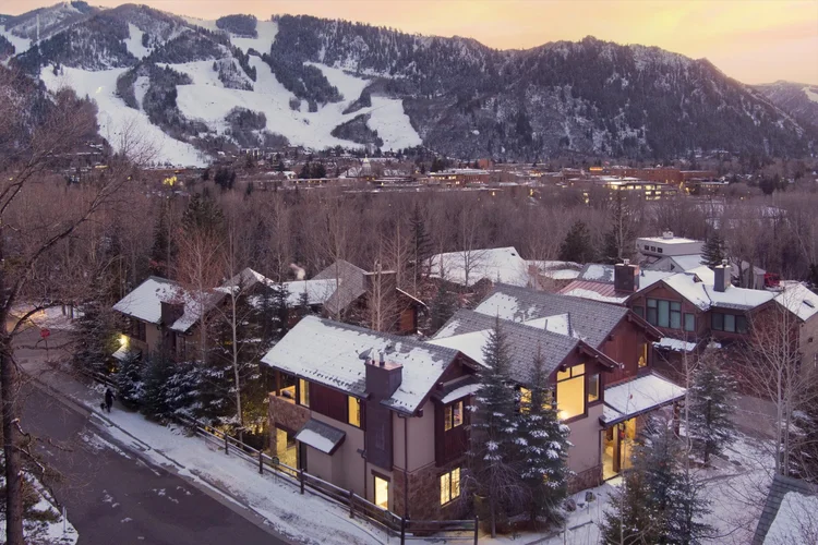 Aspen mountain home at sunset with Aspen Mountain behind