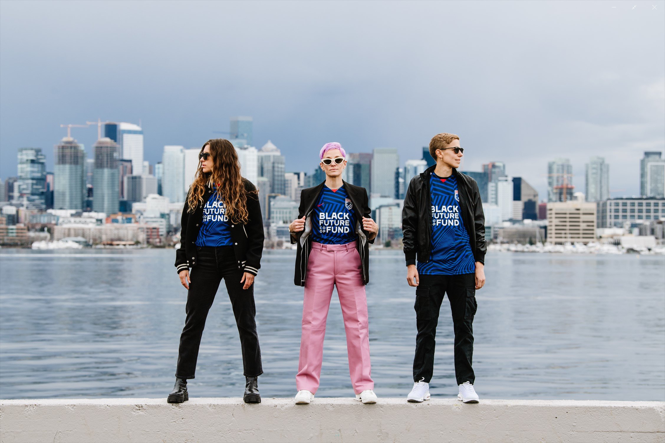 Sofia Huerta, Megan Rapinoe and Quinn wearing the Purpose kit