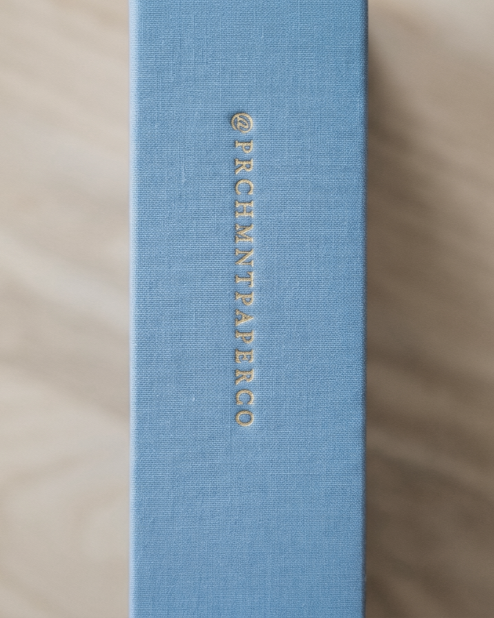 Blue linen PRCHMNT three-year reflection journal with gold foil spine