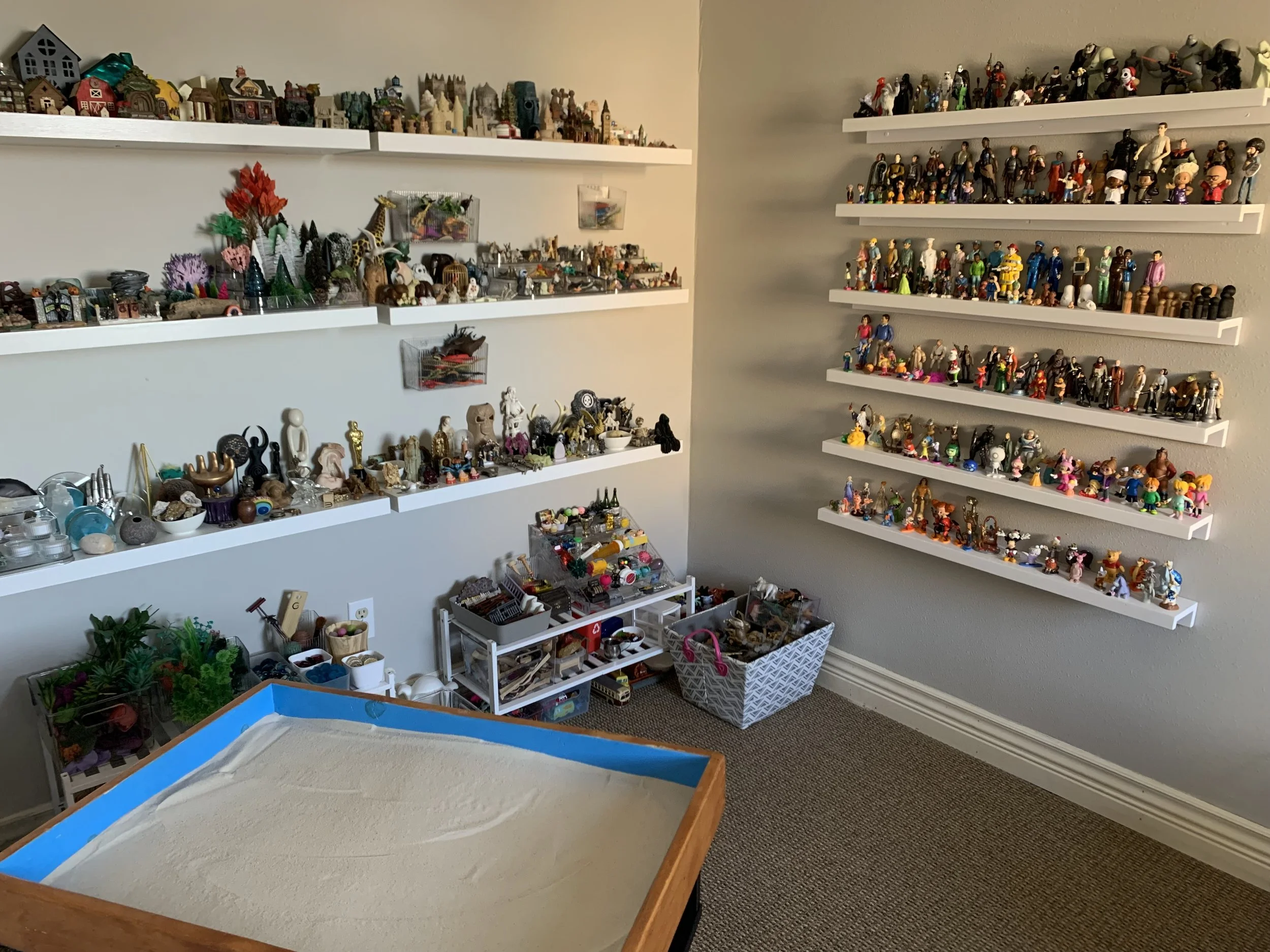 Sand tray with shelves of miniatures