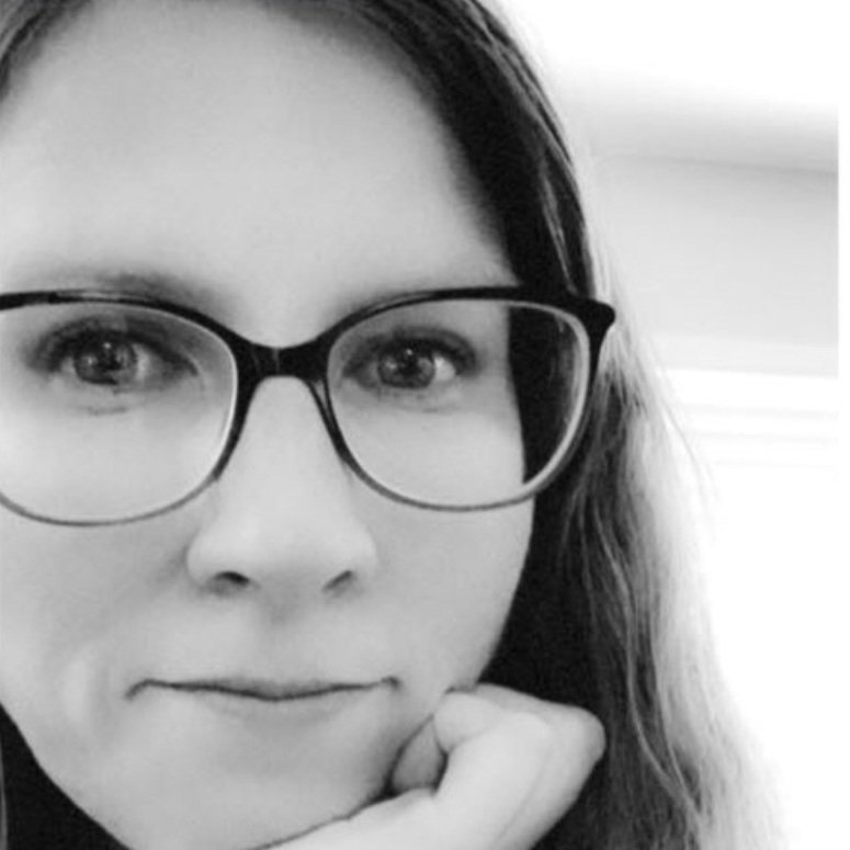 black and white photo of Susan looking boldly into the camera