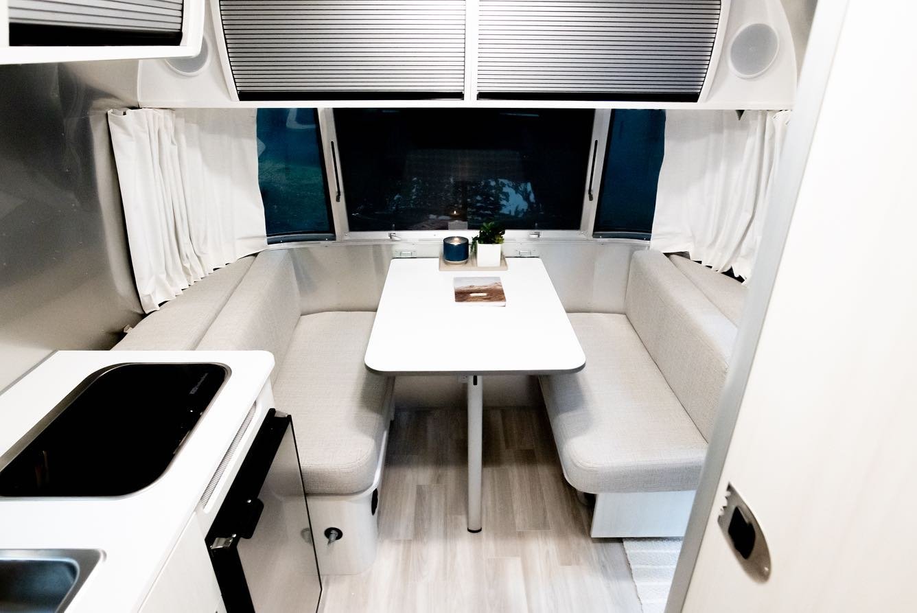 The kitchen and dining area of the airstream