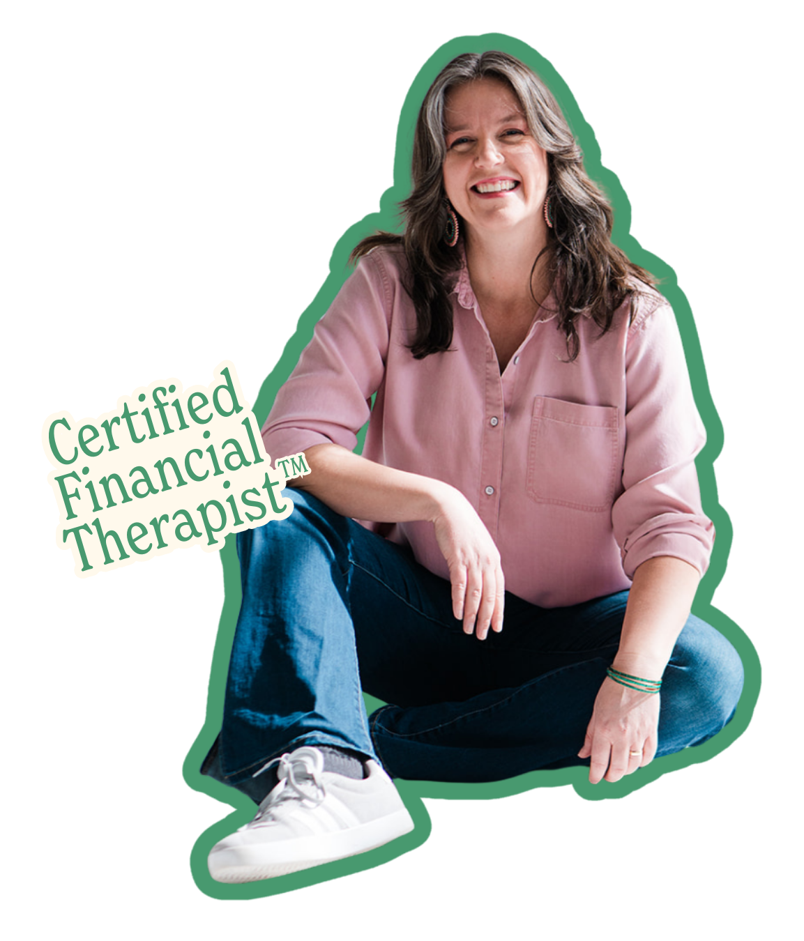 Smiling woman sitting cross-legged, wearing a pink shirt, blue jeans, and white sneakers, with a 'Certified Financial Therapist' badge.