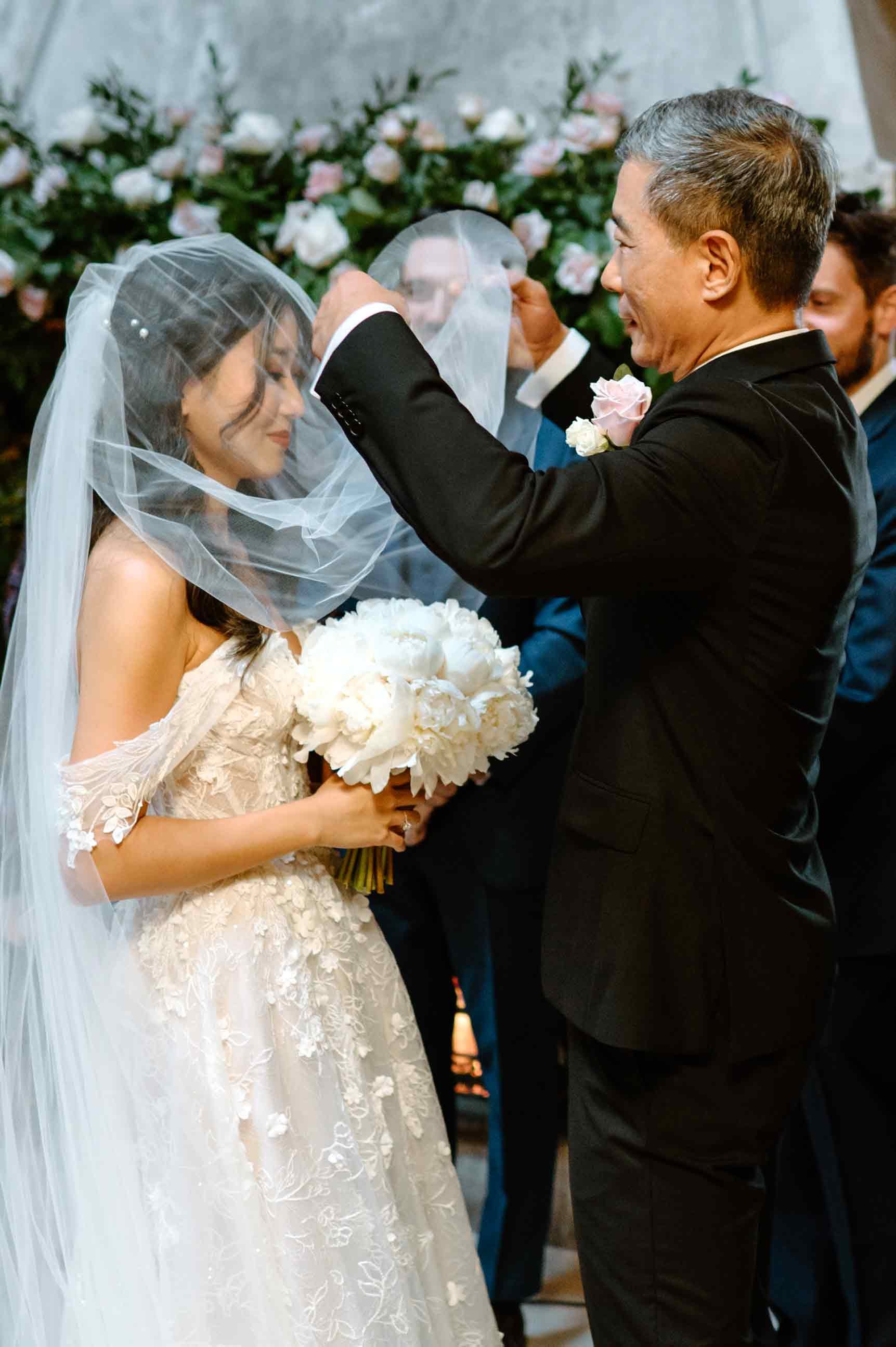 dad-flipping-brides-veil-ceremony.jpg