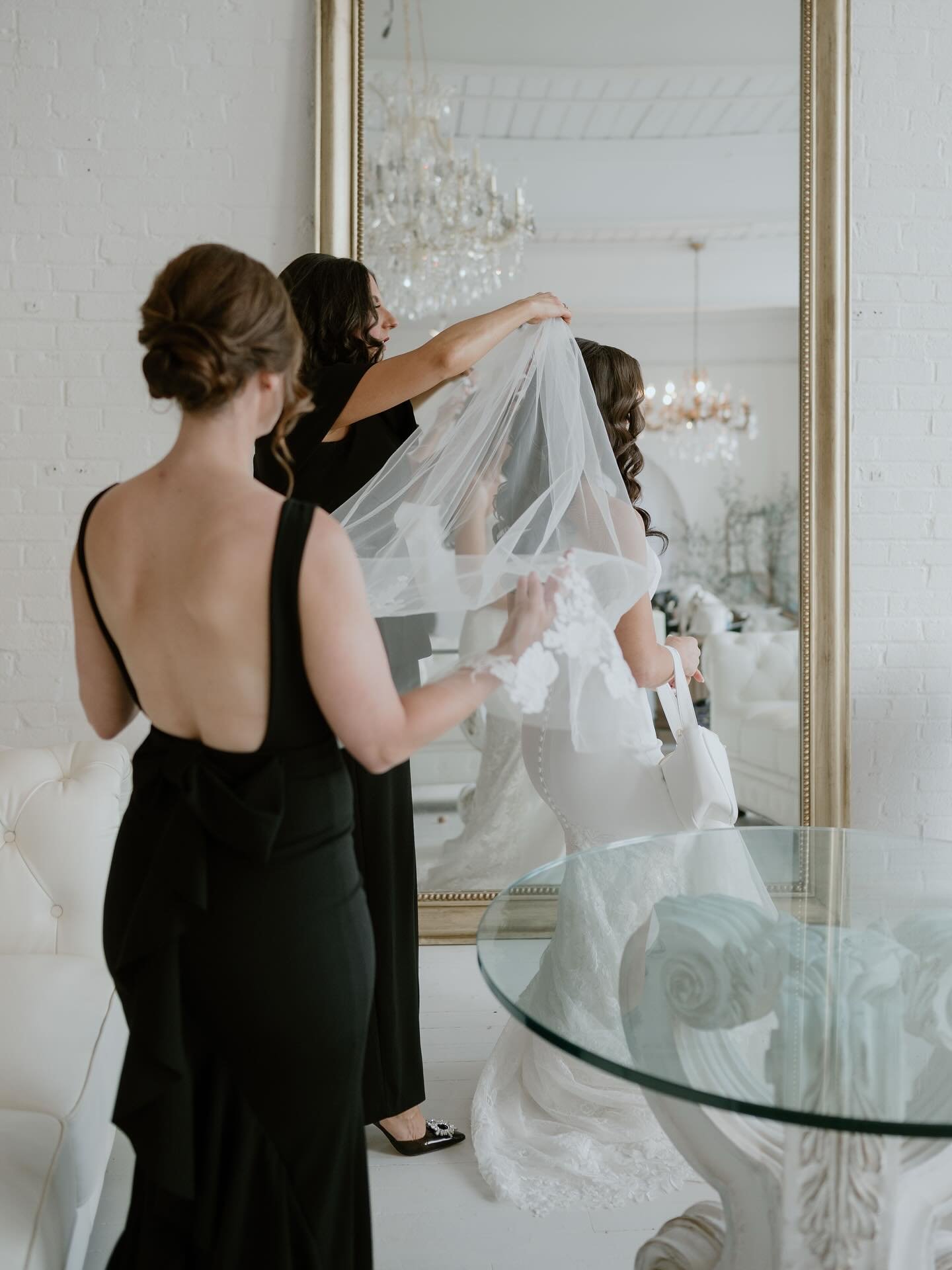 Melissa kicked off her wedding morning surrounded by her closest people in the industrial charm of the Pajama Factory. With her girls by her side and an editorial vision in mind, we leaned into flash, contrast, and texture to create something timeles