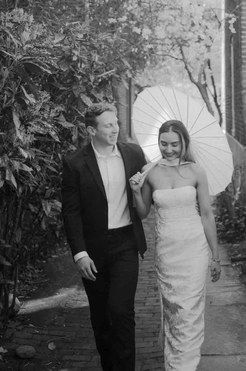Couple walking through Old City Philadelphia during spring engagement session