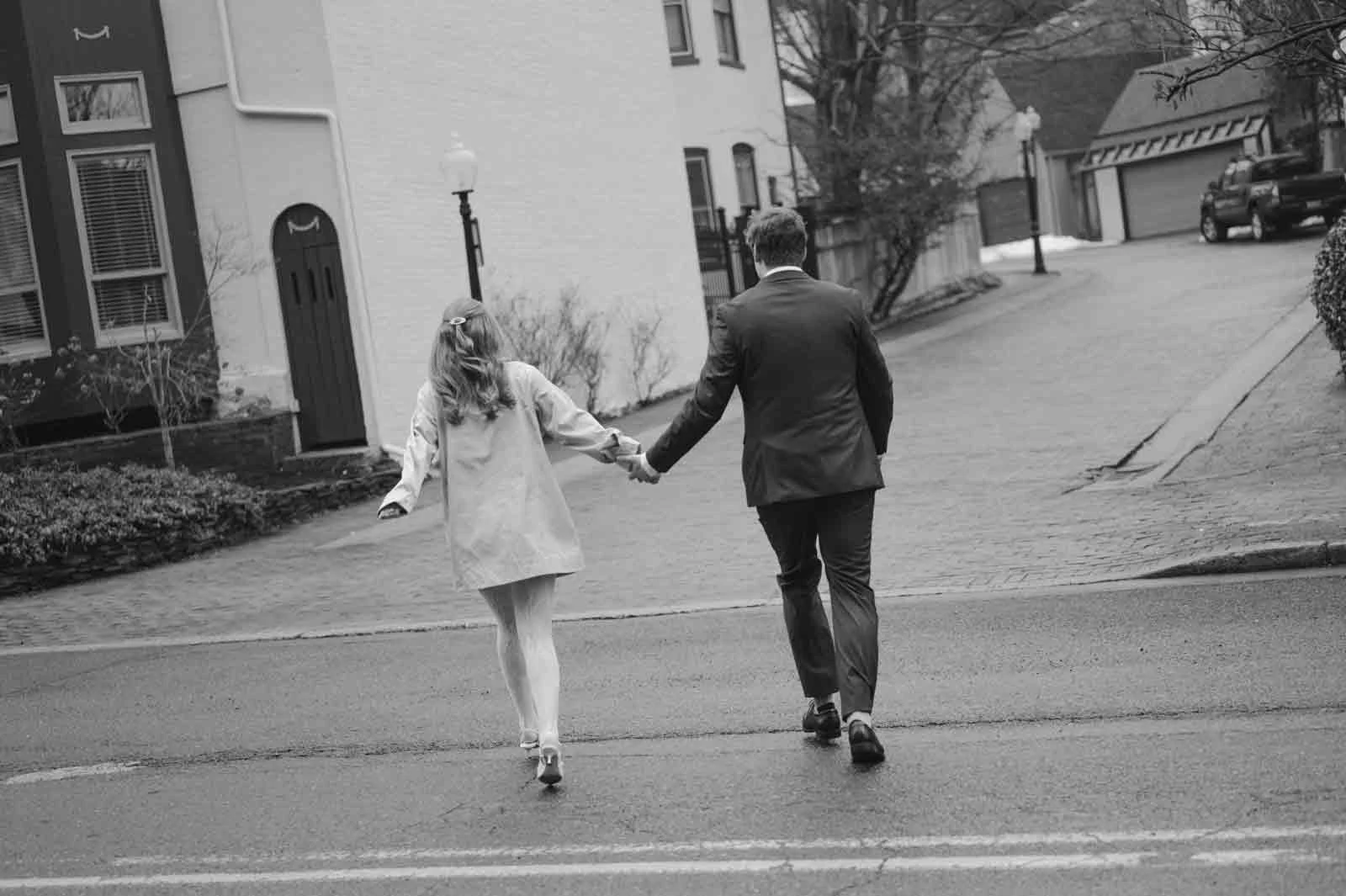 Lancaster PA micro wedding couple walking through downtown streets in the rain