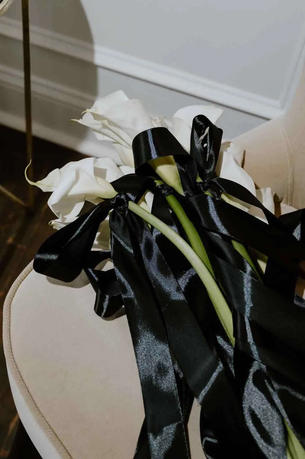 calla lily florals for wedding at iron front in Lewisburg, tied up with a satin bow
