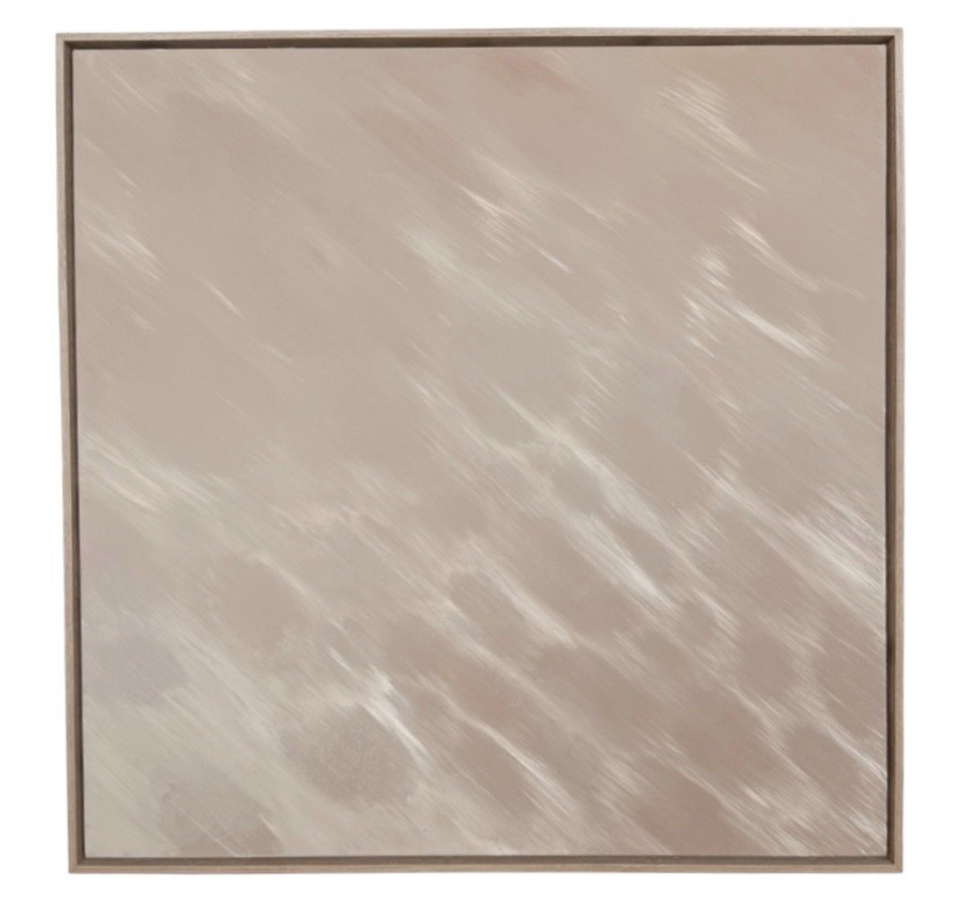 A square wall mirror with a beige and light brown marbled surface and a thin wooden frame.