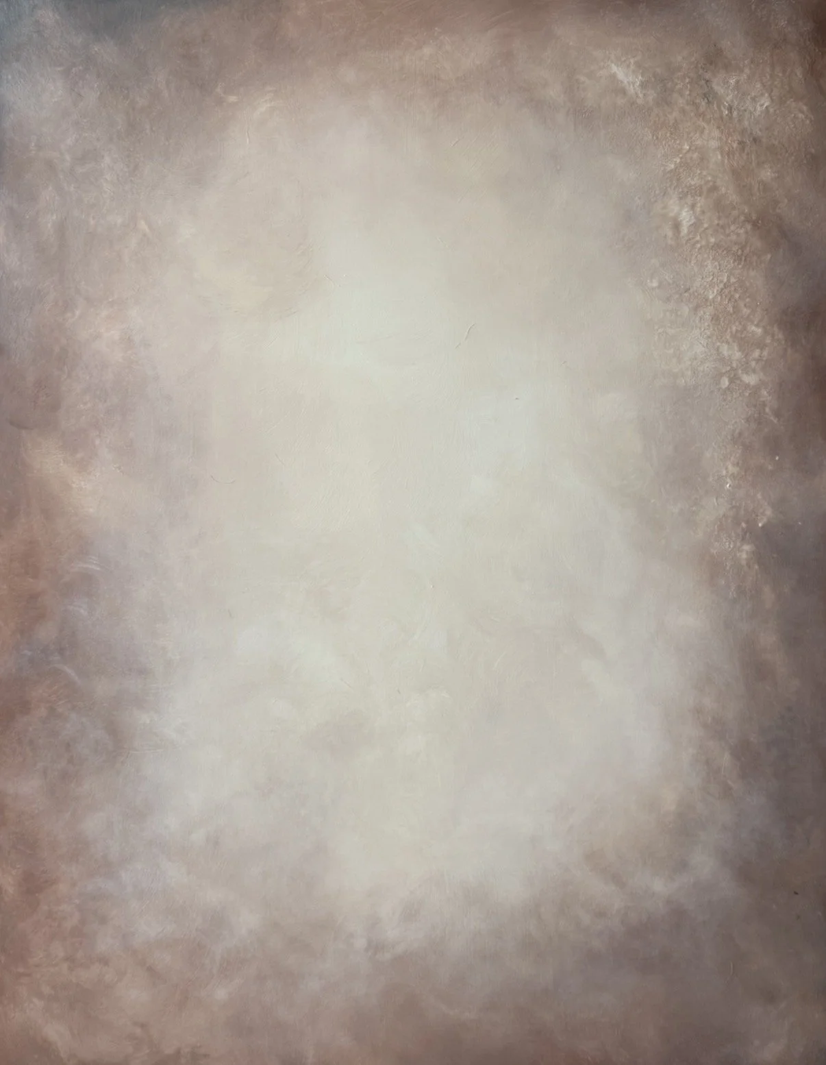 Close-up of a textured surface, possibly a stain or pattern on a wall or floor, with a circular shape in the center