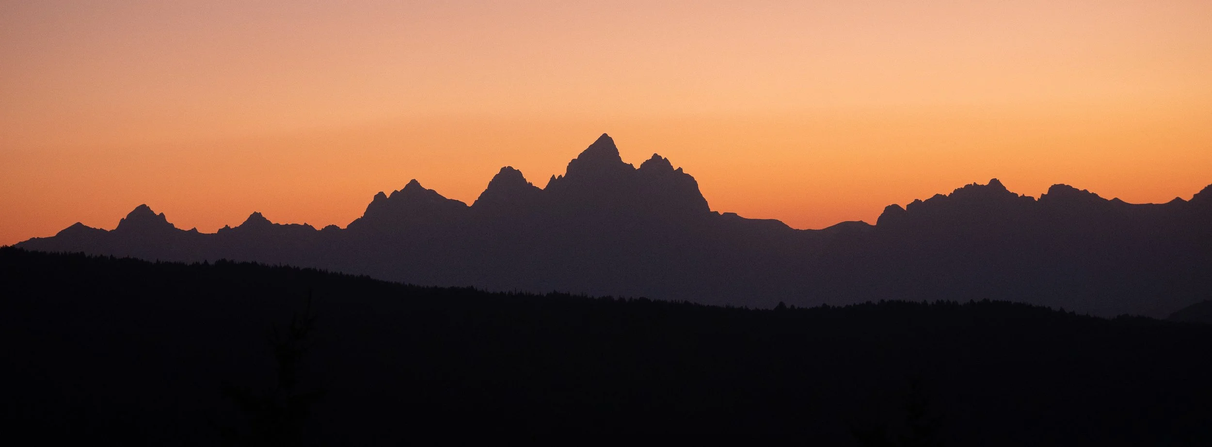 GRAND SUNSET – The Grand Teton silhouetted in fire-breathing orange.