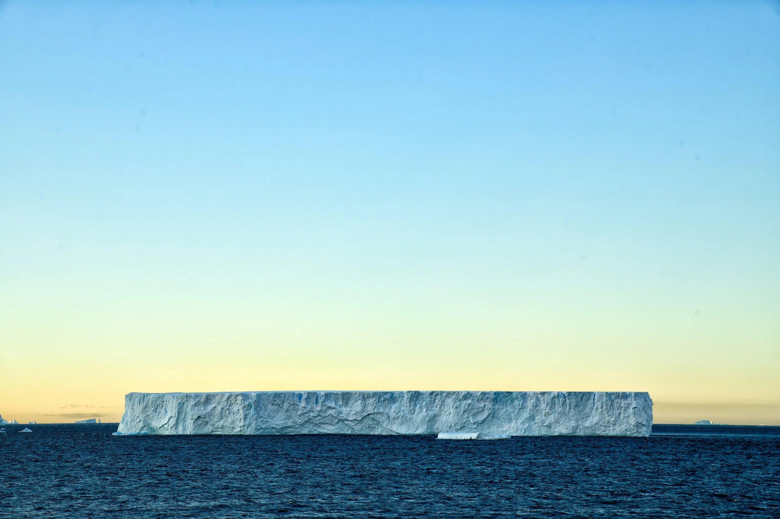 FLAT TOP – A tabular iceberg drifts in the Bellinghausen Sea at dawn just off the west coast of the Antarctic Peninsula.