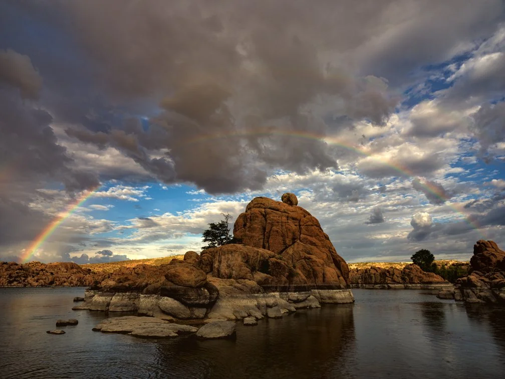 A SIGN - While waiting to shoot the sunset on the shore of Watson Lake, a perfect rainbow manifests itself in the looming clouds.
