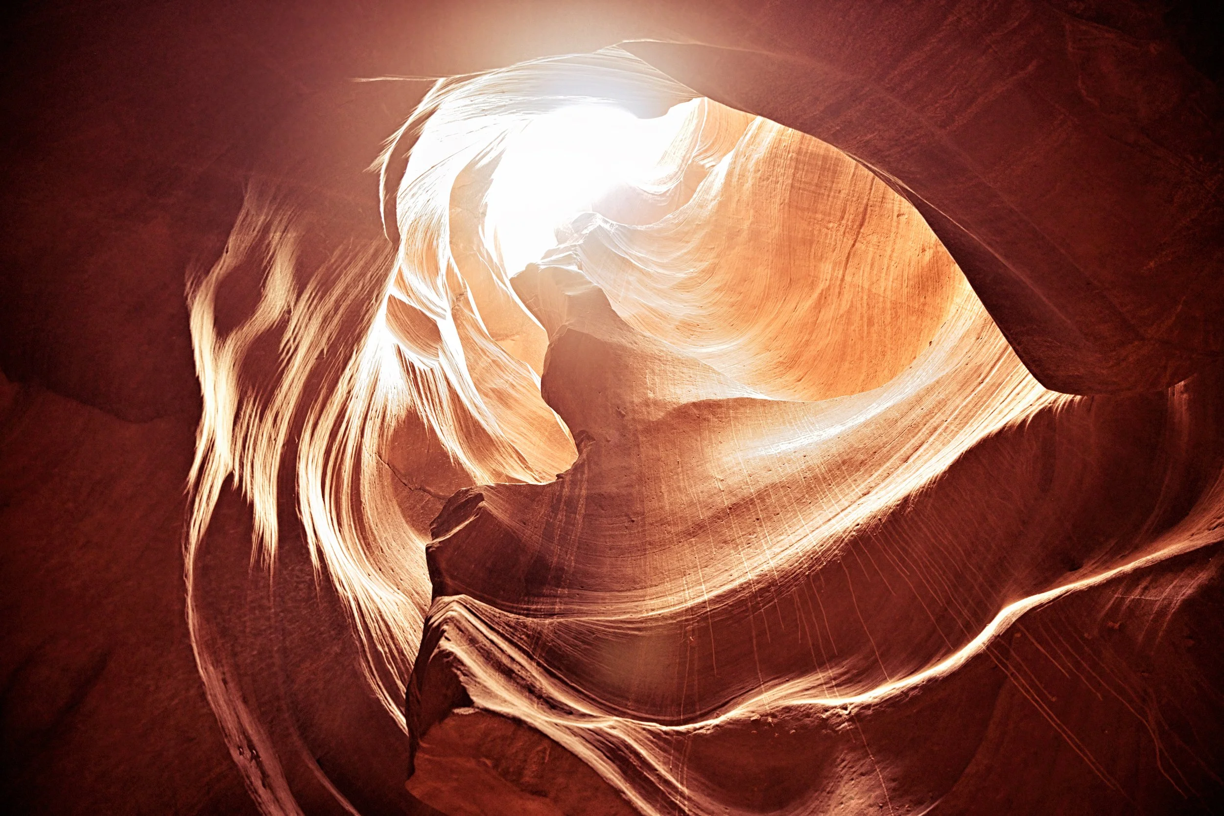 THE HEART – Sunlight peers through a heart-shaped skylight carved in the roof of Upper Antelope Canyon.