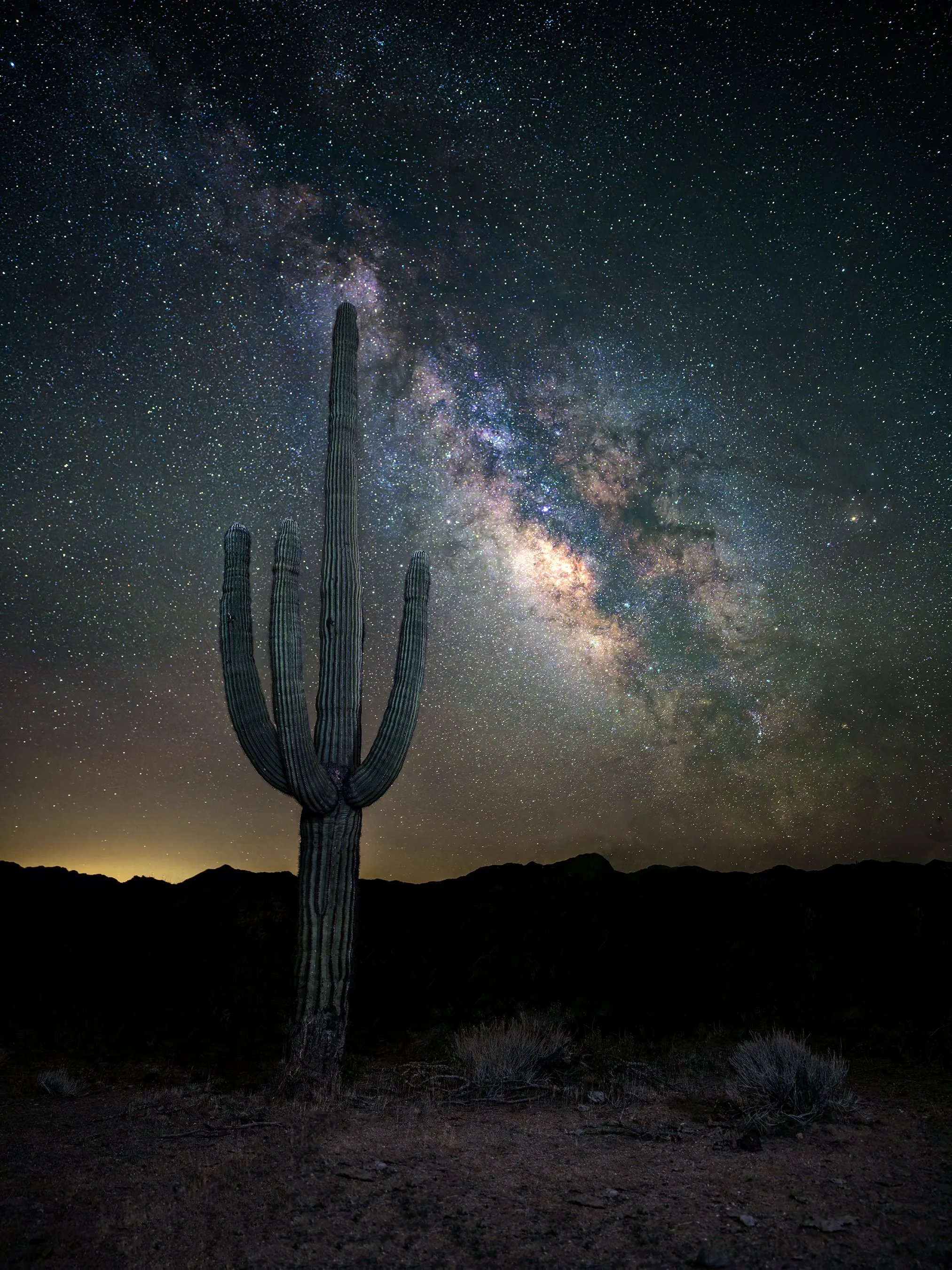 NIGHTWATCH – On the upper banks of the Santa Maria river east of Bagdad, Arizona stands an ever-vigilant Saguaro watching the stars as they make their nightly foray across the heavens. Using two strobes and an 11-second exposure, I captured this cact