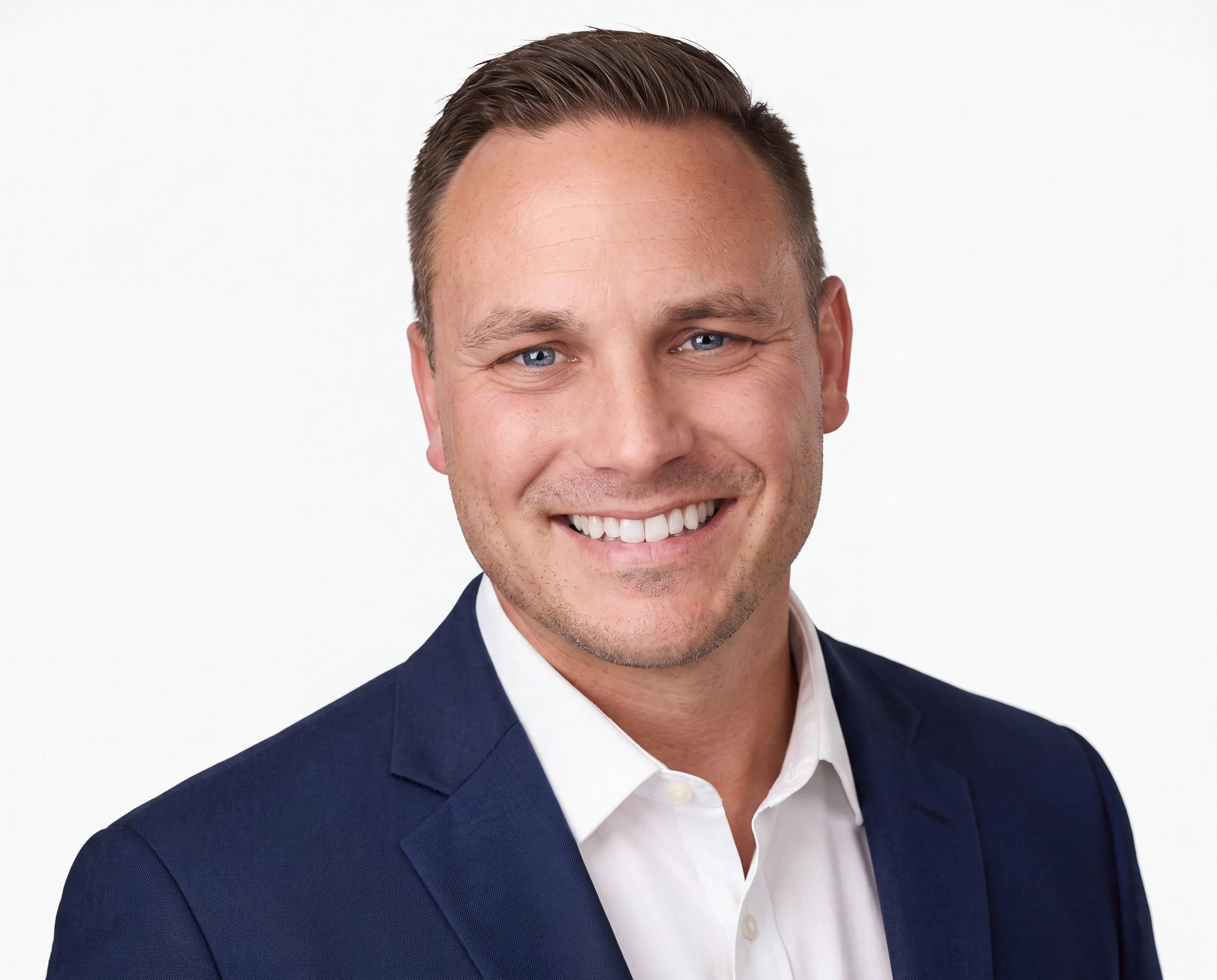 A man wearing a navy blazer