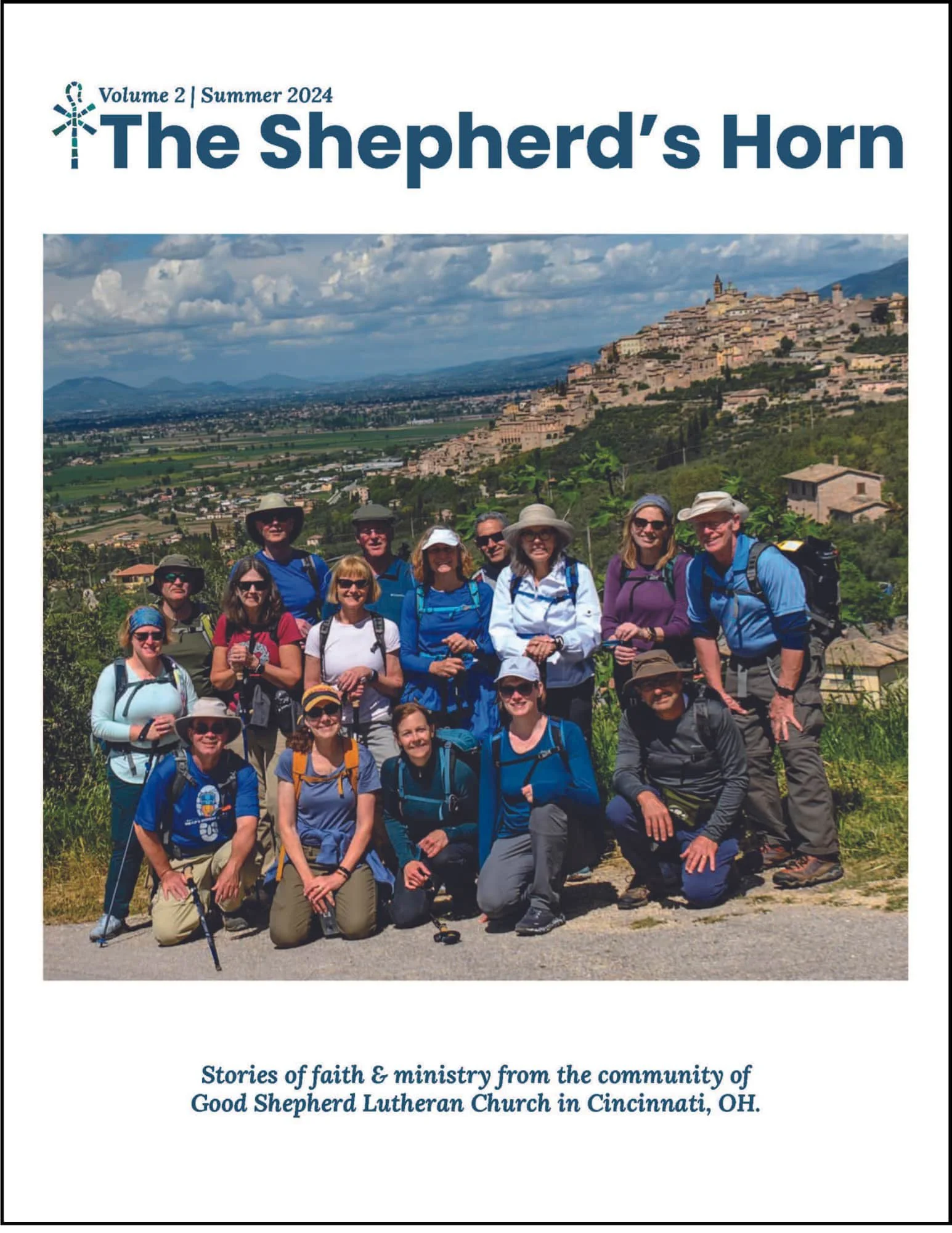 Cover of the Summer 2024 The Shepherd's Horn magazine with adults posed in front of a beautiful mountain landscape while hiking on a pilgrimage.