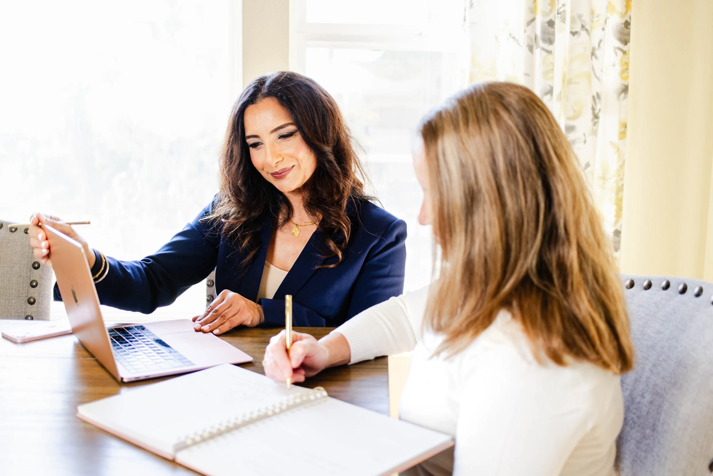 Photographer and client reviewing photos and collaborating during a New Jersey brand photography session